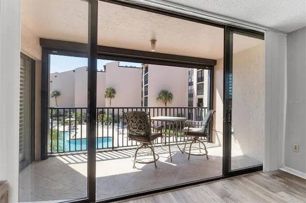 a view of a porch with a glass door
