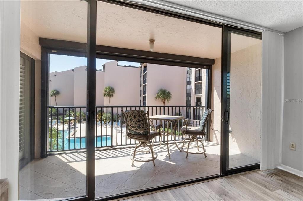 6480 Midnight Pass Road, Unit 311 Sarasota, FL 34242 - Photo 32 of 48 a view of a porch with a glass door