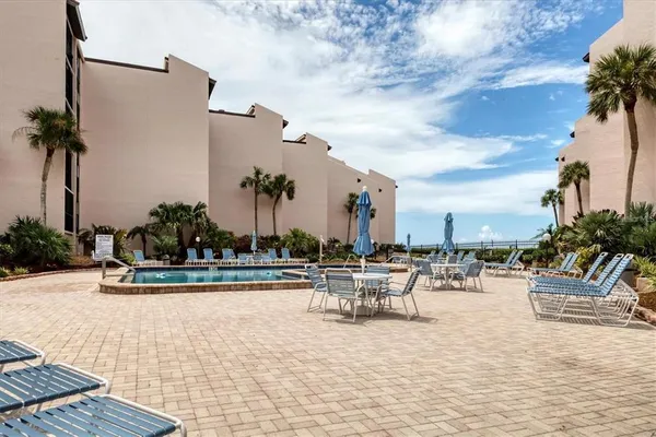 a view of a swimming pool with a lounge chair