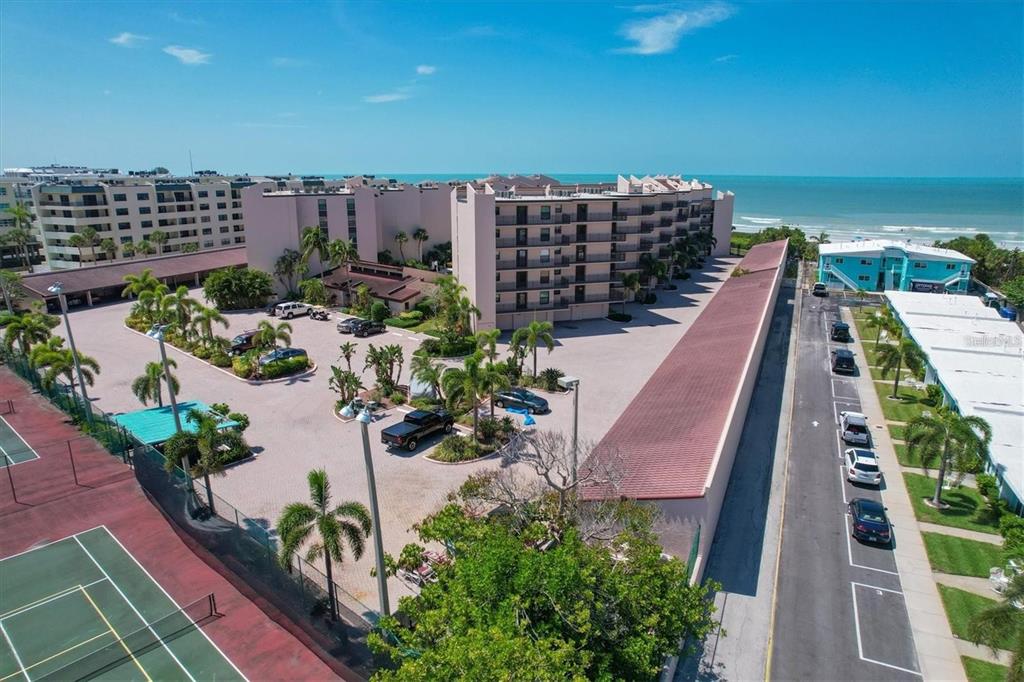 6480 Midnight Pass Road, Unit 311 Sarasota, FL 34242 - Photo 44 of 48 a view of a yard and swimming pool