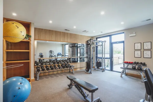 a bedroom with furniture and a large window
