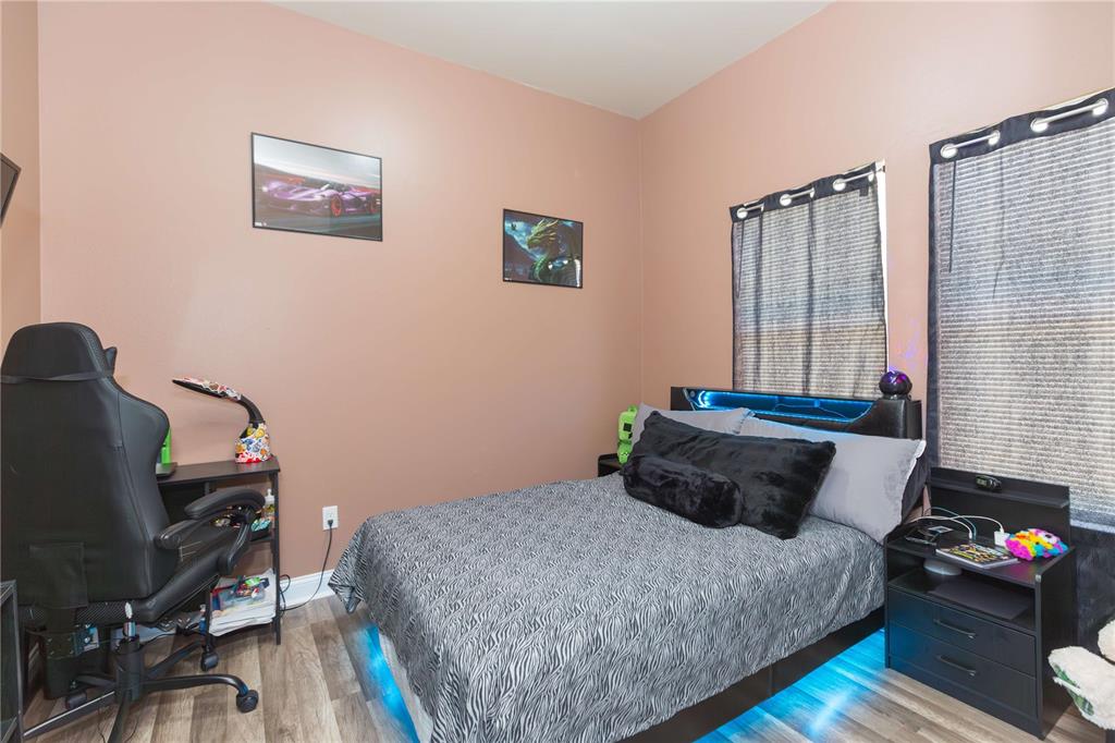 2322 West Cherry Street Tampa, FL 33607 - Photo 6 of 36 a bedroom with a bed and wooden floor
