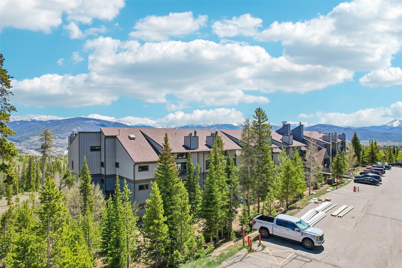 89310 Ryan Gulch Road, Unit 103 Silverthorne, CO 80498 - Photo 32 of 48 a aerial view of a house with swimming pool and garden view