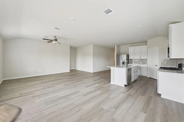 a view of kitchen and wooden floor
