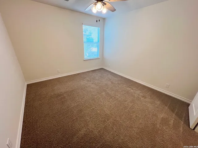 an empty room with a bathroom