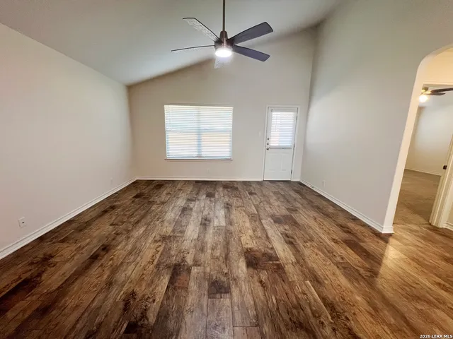 a view of a kitchen with sink and window