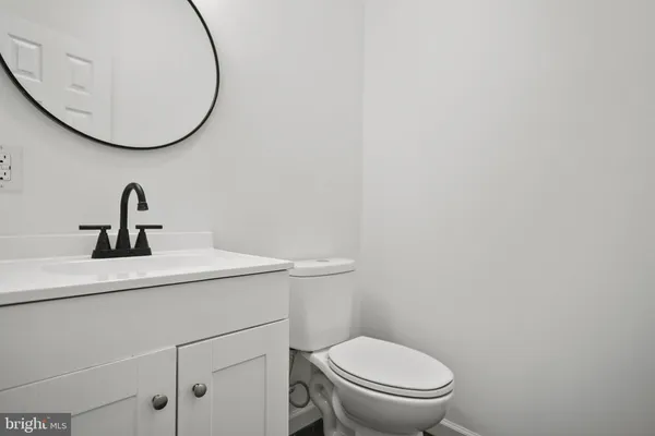 a bathroom with a toilet and a sink