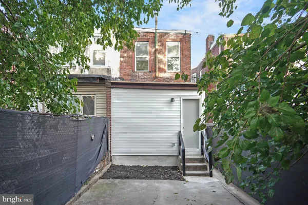a view of a house with a tree