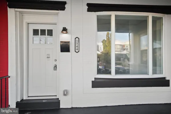 a view of front door and a window