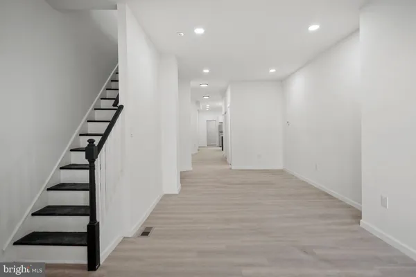a view of entryway with wooden floor