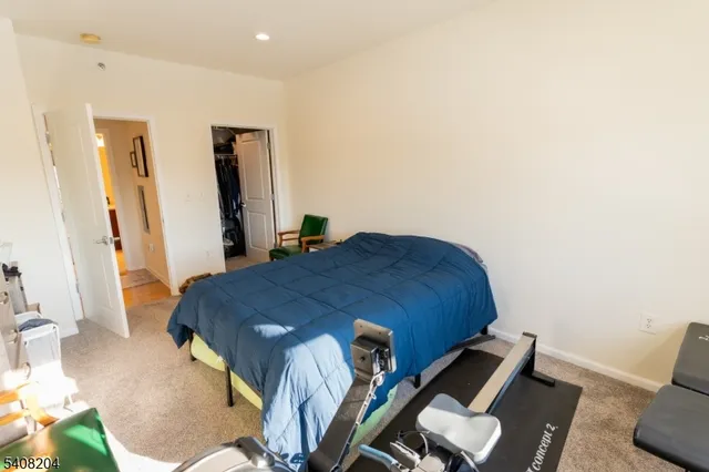 a bed sitting in a room next to a window