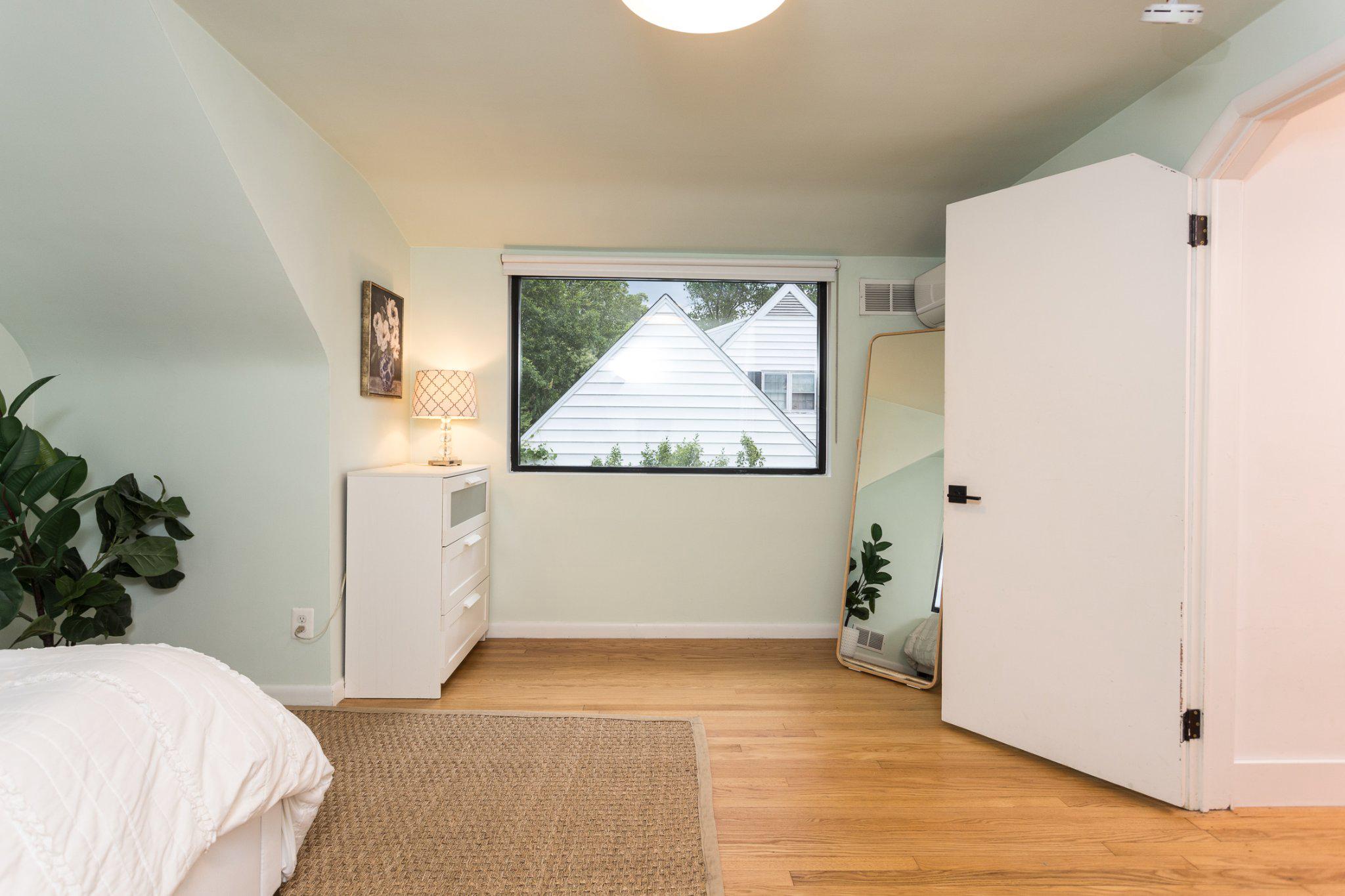 7006 Copeleigh Road Baltimore, MD 21212 - Photo 28 of 43 a view of a bedroom with wooden floor and front door