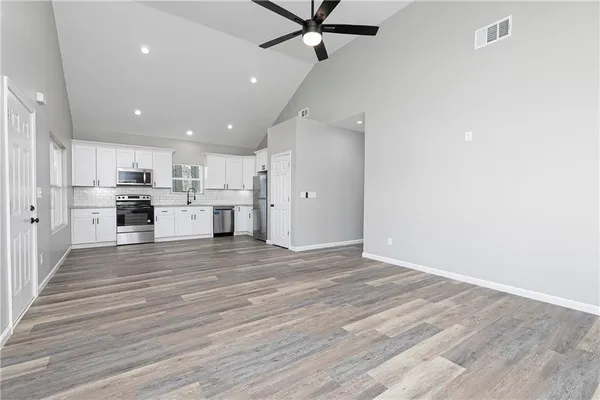 a view of kitchen view wooden floor and window