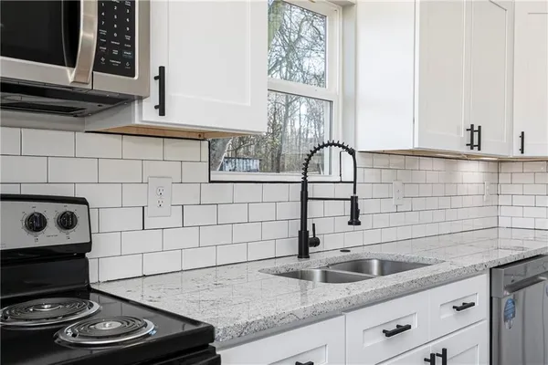 a kitchen with a sink and cabinets
