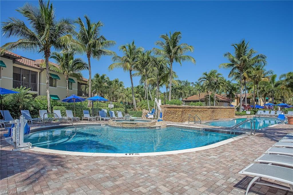 1015 Sandpiper Street, Unit D102 Naples, FL 34102 - Photo 23 of 34 a view of a swimming pool with a patio
