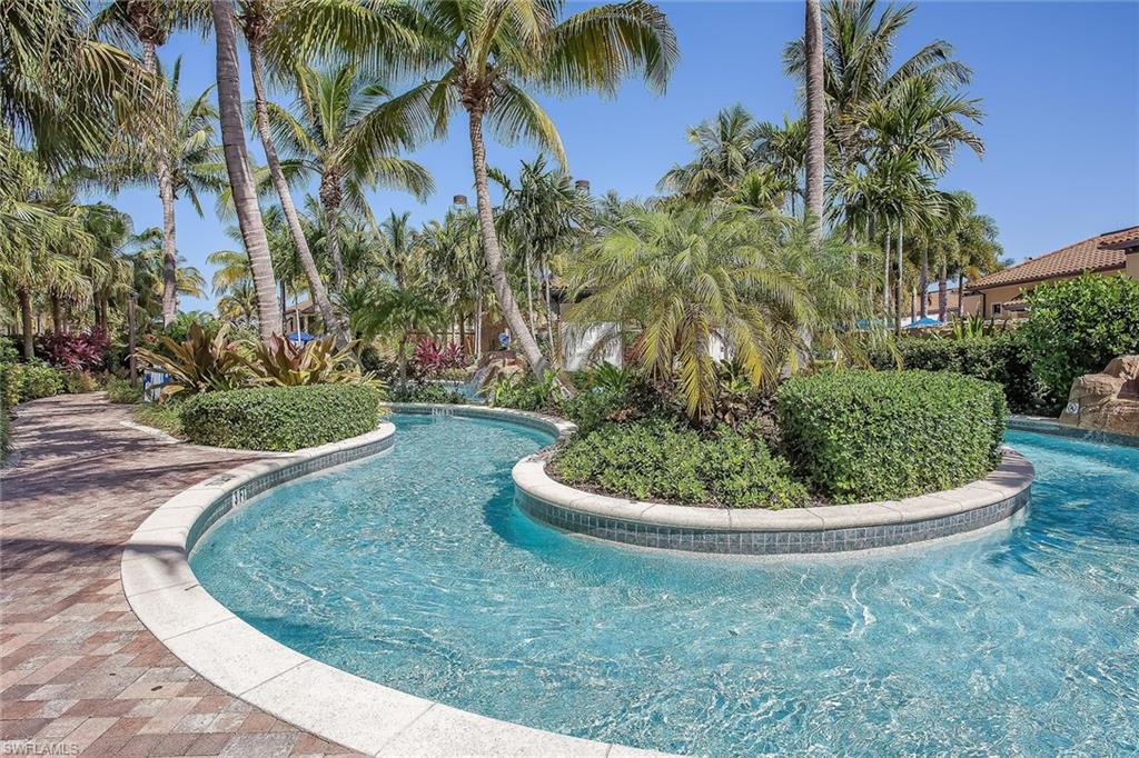 1015 Sandpiper Street, Unit D102 Naples, FL 34102 - Photo 24 of 34 a view of a garden with palm trees