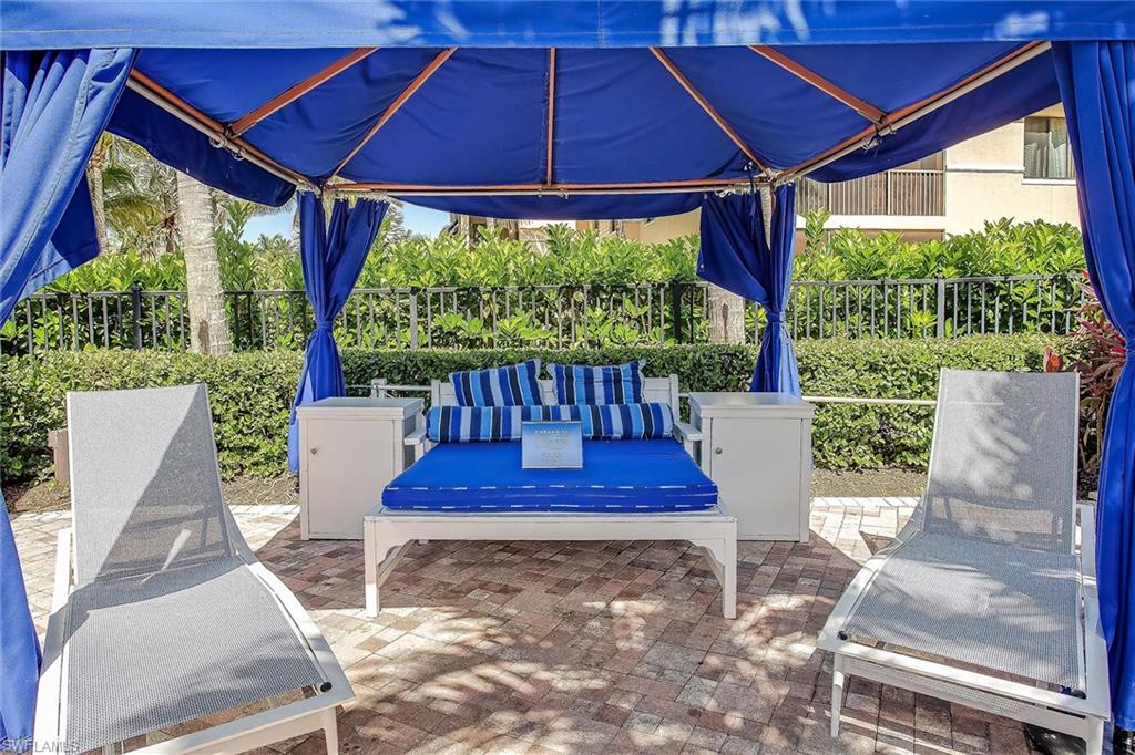 1015 Sandpiper Street, Unit D102 Naples, FL 34102 - Photo 25 of 34 a view of an outdoor sitting area with couch