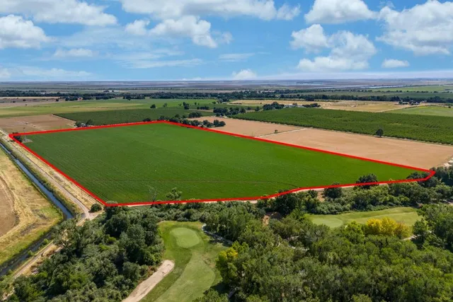 a view of a golf course with a lake