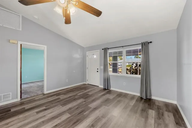 a view of an empty room and window