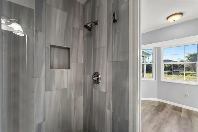 a view of a bathroom from a hallway