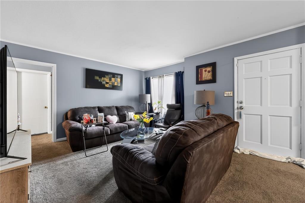 1819 Canterbury Road Macon, GA 31206 - Photo 6 of 15 a living room with furniture a couch and a window