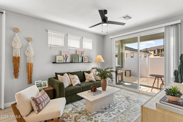a living room with furniture and a large window
