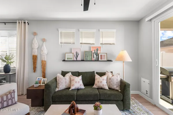 a living room with furniture and a window