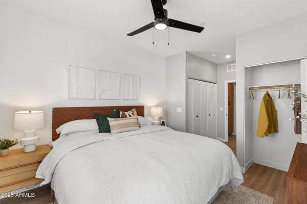 a bedroom with a bed and a walk in closet