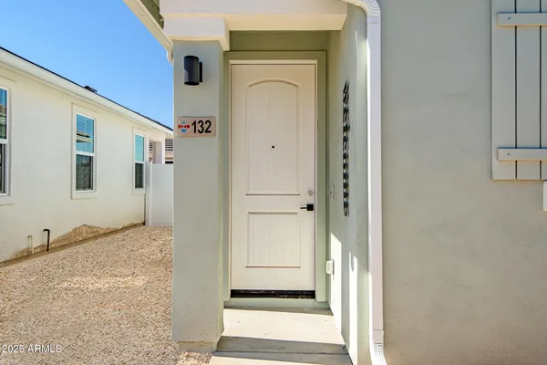 a view of a hallway with wooden floor and entryway