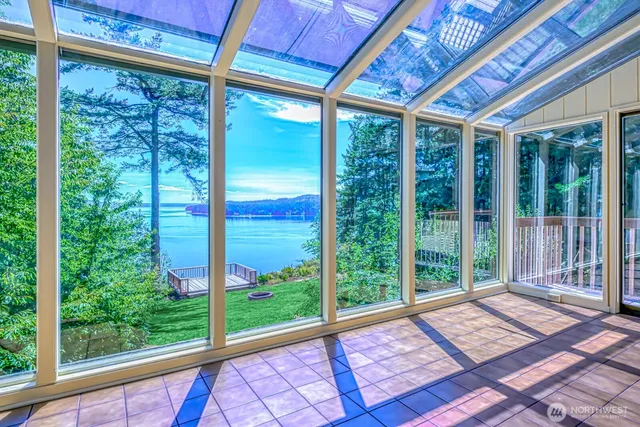 a view of a room with wooden floor and iron stairs