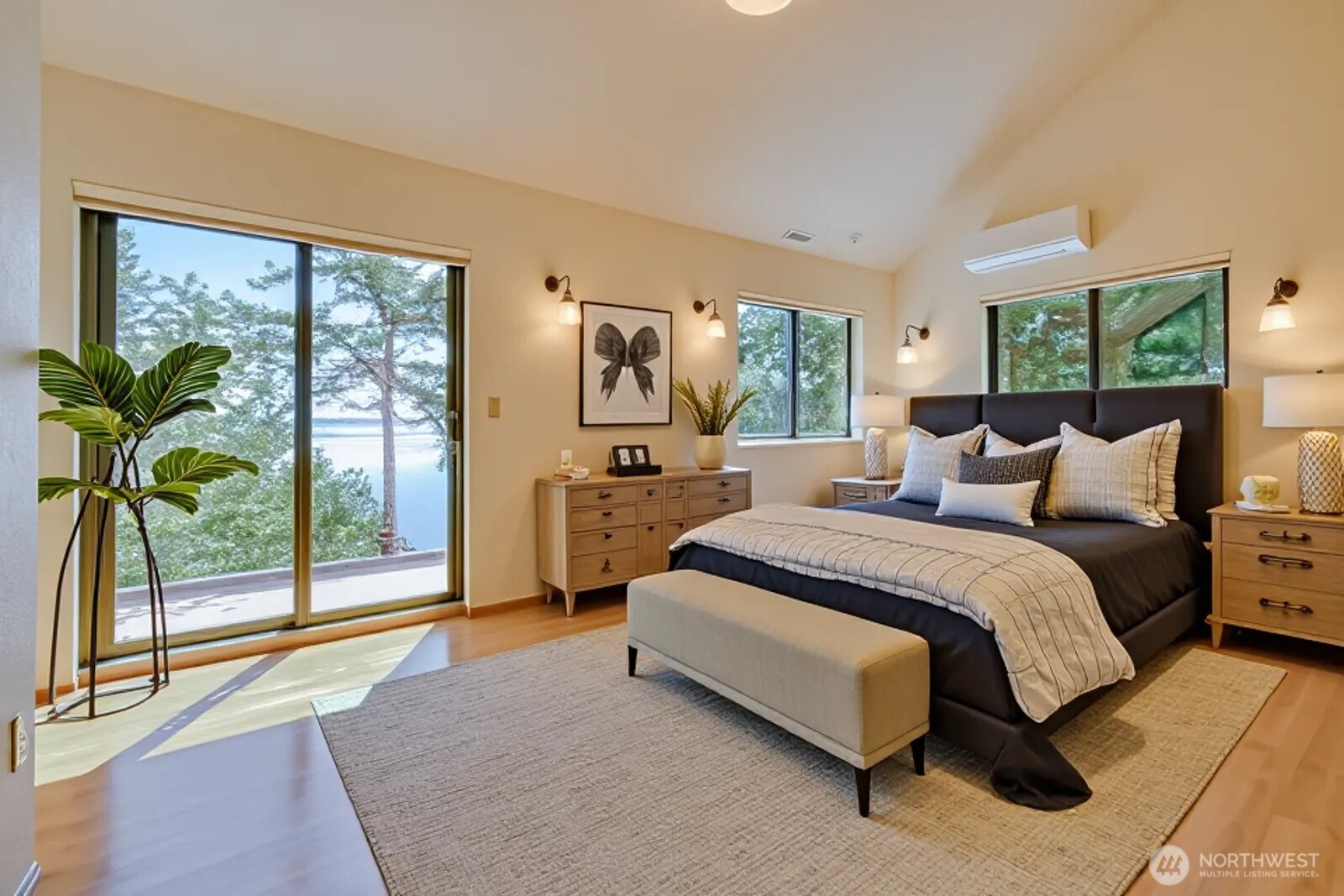 241 Gustavson Road Quilcene, WA 98376 - Photo 21 of 38 a spacious bedroom with a bed and large window