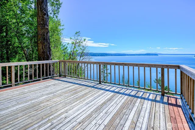 a view of deck with wooden floor and fence