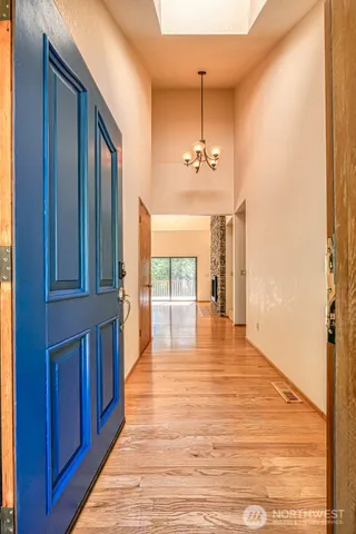 a view of a room with wooden floor