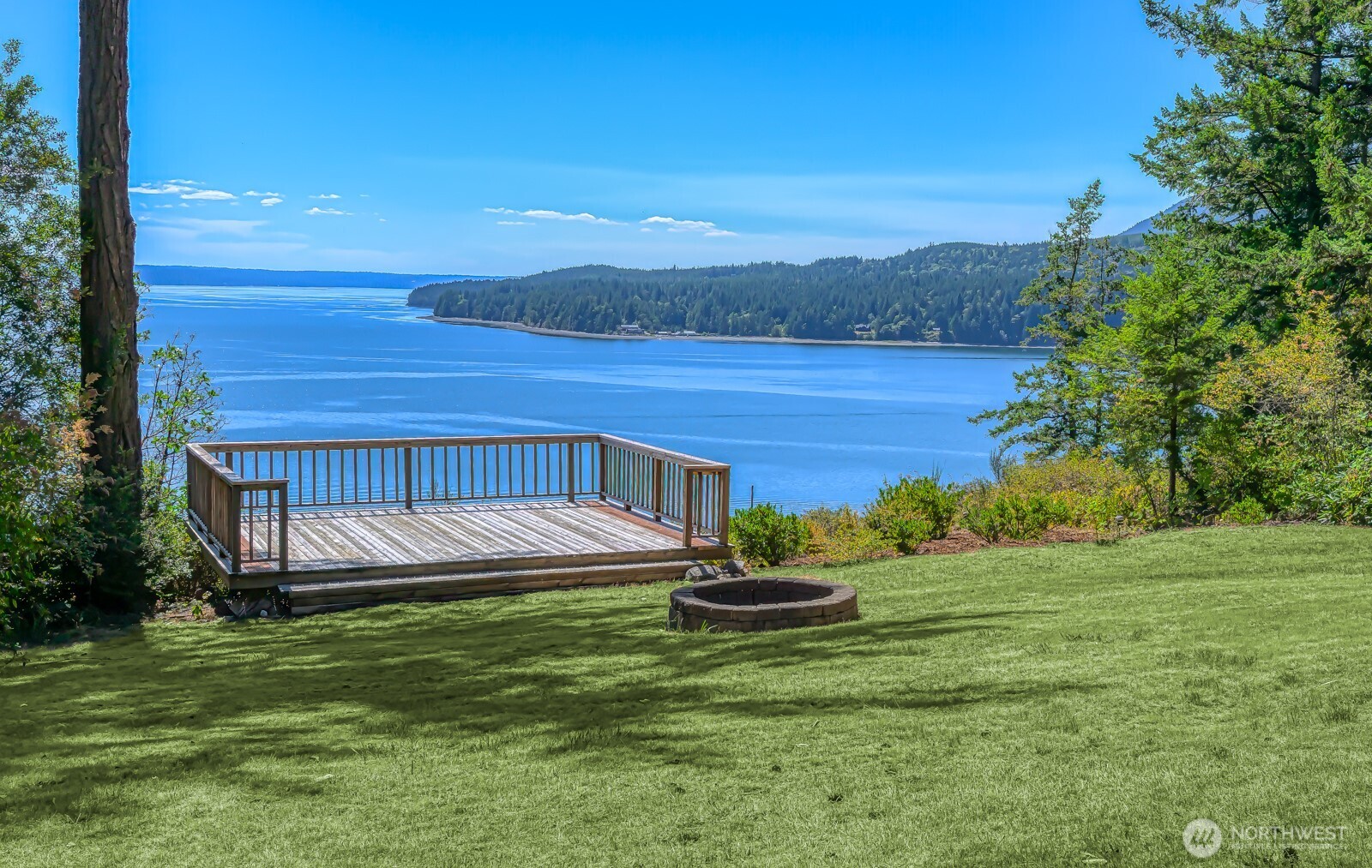 241 Gustavson Road Quilcene, WA 98376 - Photo 32 of 38 a view of a backyard with lawn chairs plants and large trees