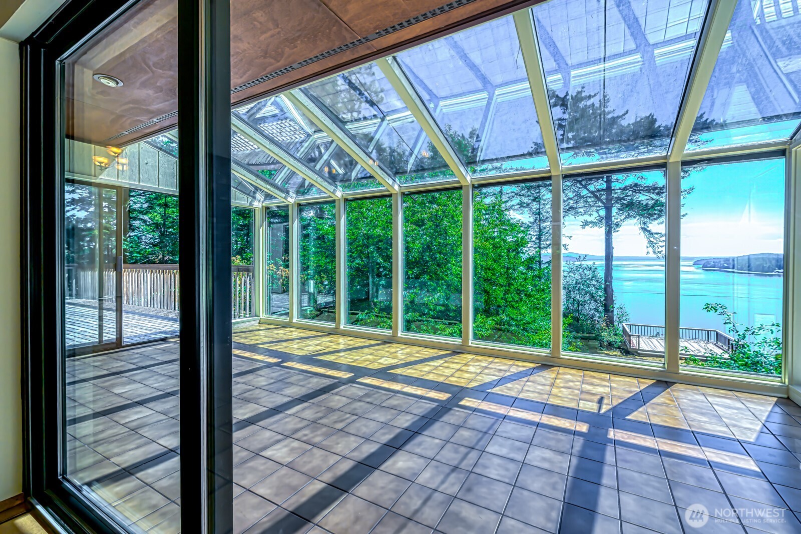 241 Gustavson Road Quilcene, WA 98376 - Photo 10 of 32 a view of a room with wooden floor and windows