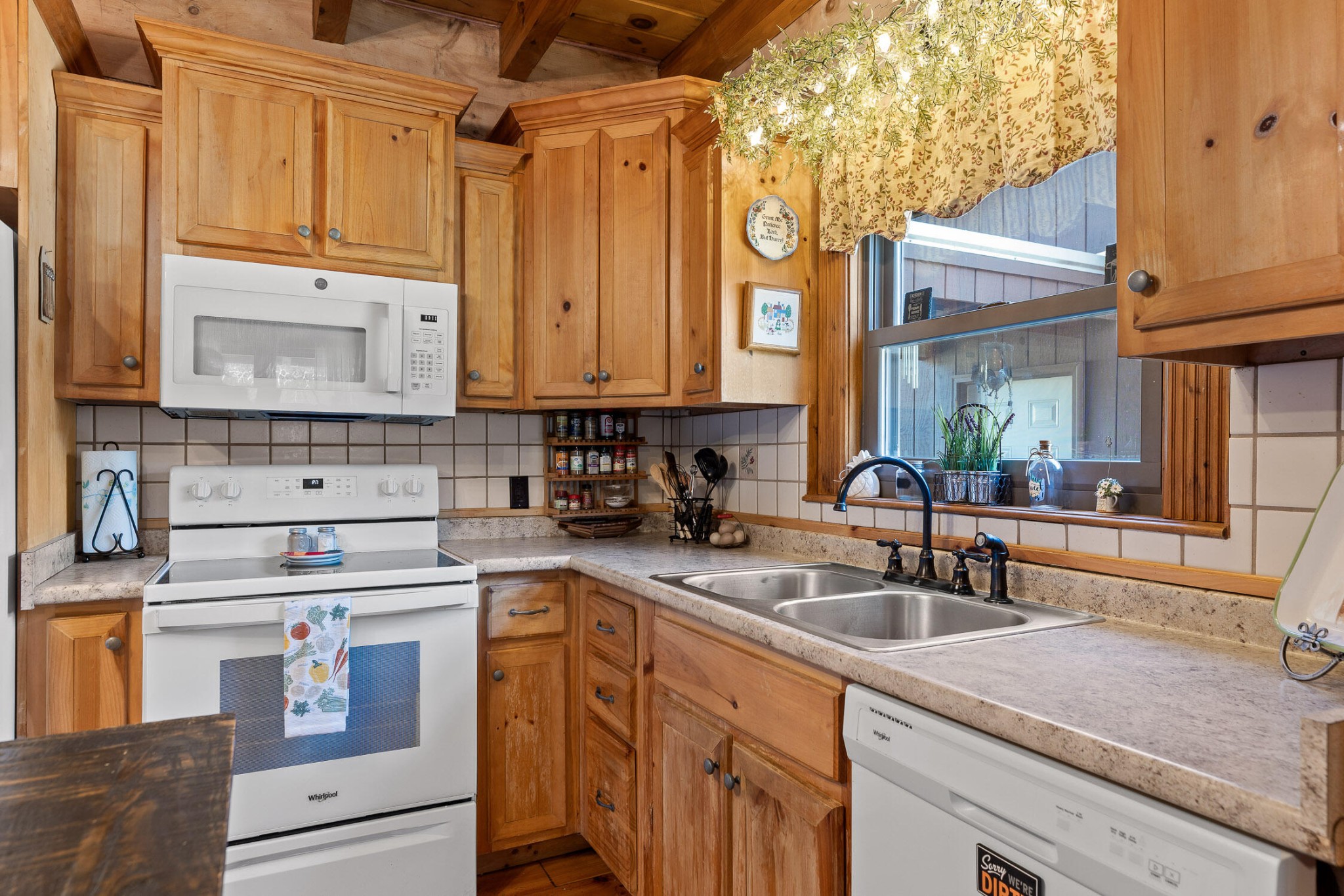 3382 Back Valley Road Trenton, GA 30752 - Photo 11 of 45 a kitchen with stainless steel appliances granite countertop a sink a stove and cabinets