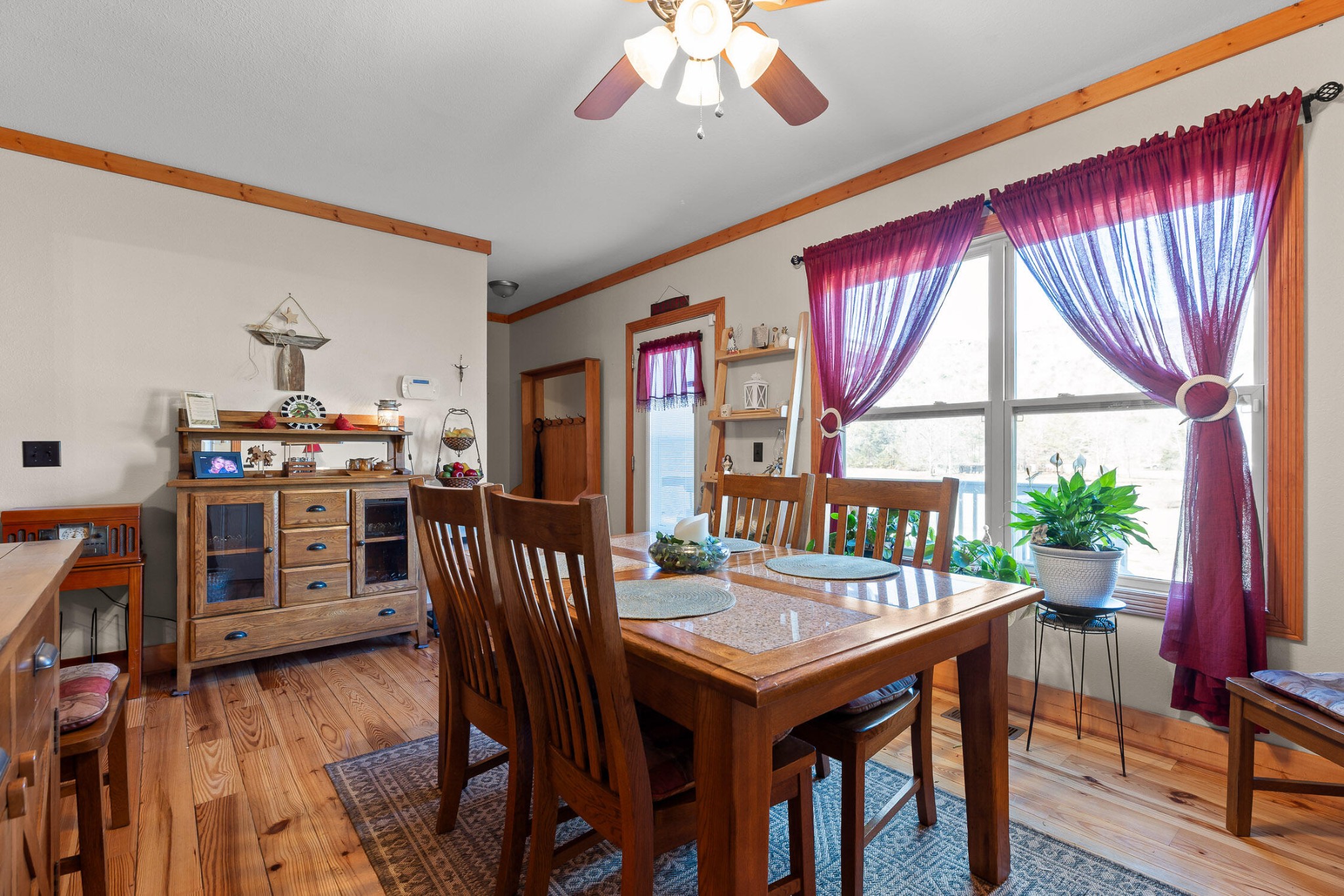 3382 Back Valley Road Trenton, GA 30752 - Photo 15 of 45 a view of a dining room with furniture window and wooden floor
