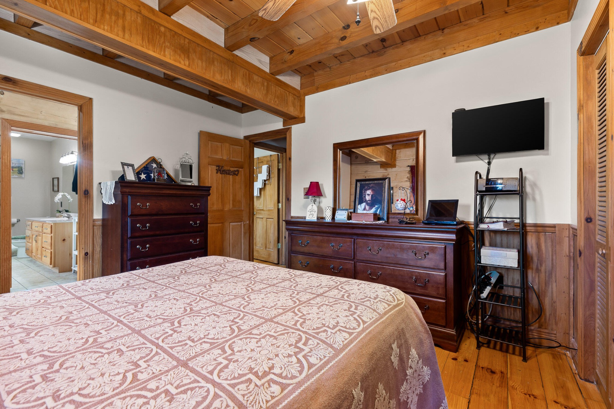 3382 Back Valley Road Trenton, GA 30752 - Photo 19 of 45 a bedroom with a bed and a flat screen tv in it