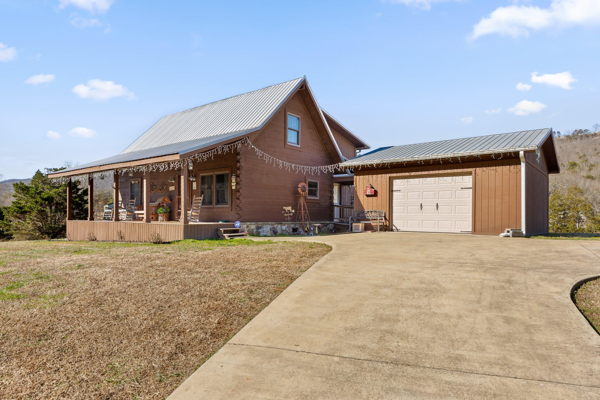 3382 Back Valley Road Trenton, GA 30752 - Photo 2 of 45 a front view of a house with a yard and garage
