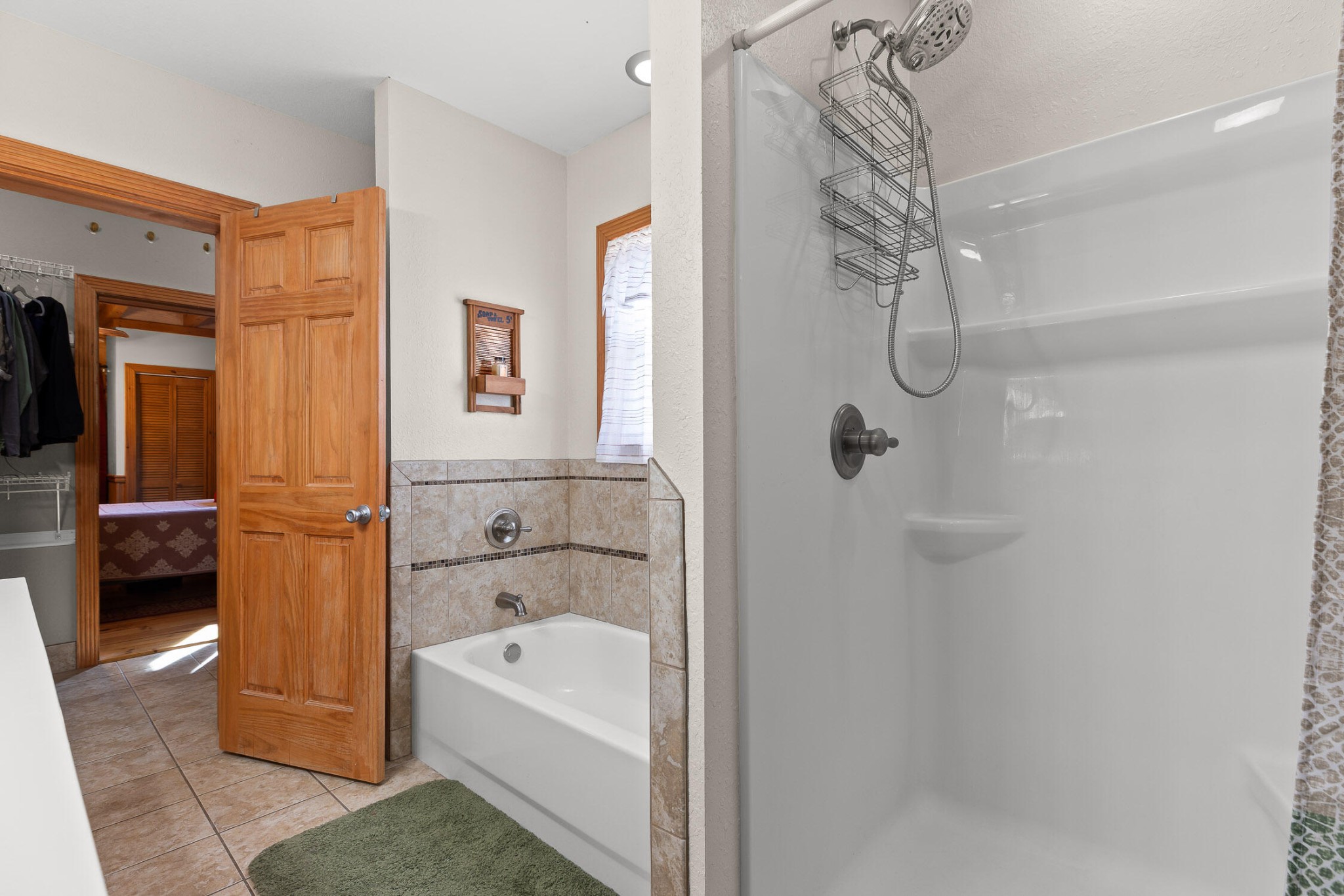 3382 Back Valley Road Trenton, GA 30752 - Photo 21 of 45 a bathroom with a bathtub and a shower