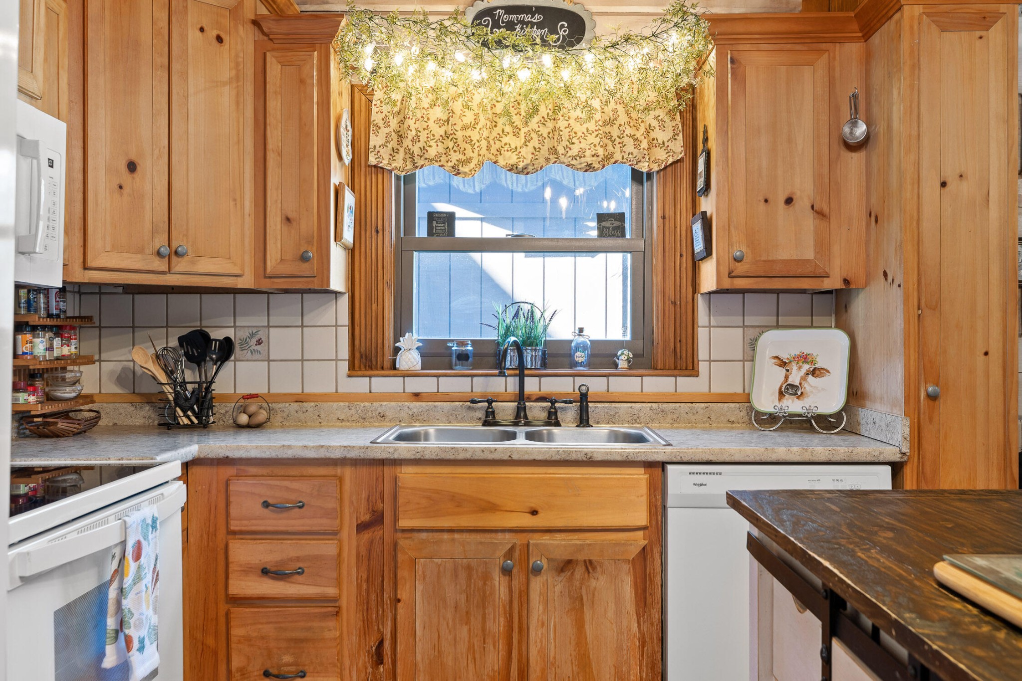 3382 Back Valley Road Trenton, GA 30752 - Photo 10 of 45 a kitchen with stainless steel appliances granite countertop a sink a stove and cabinets