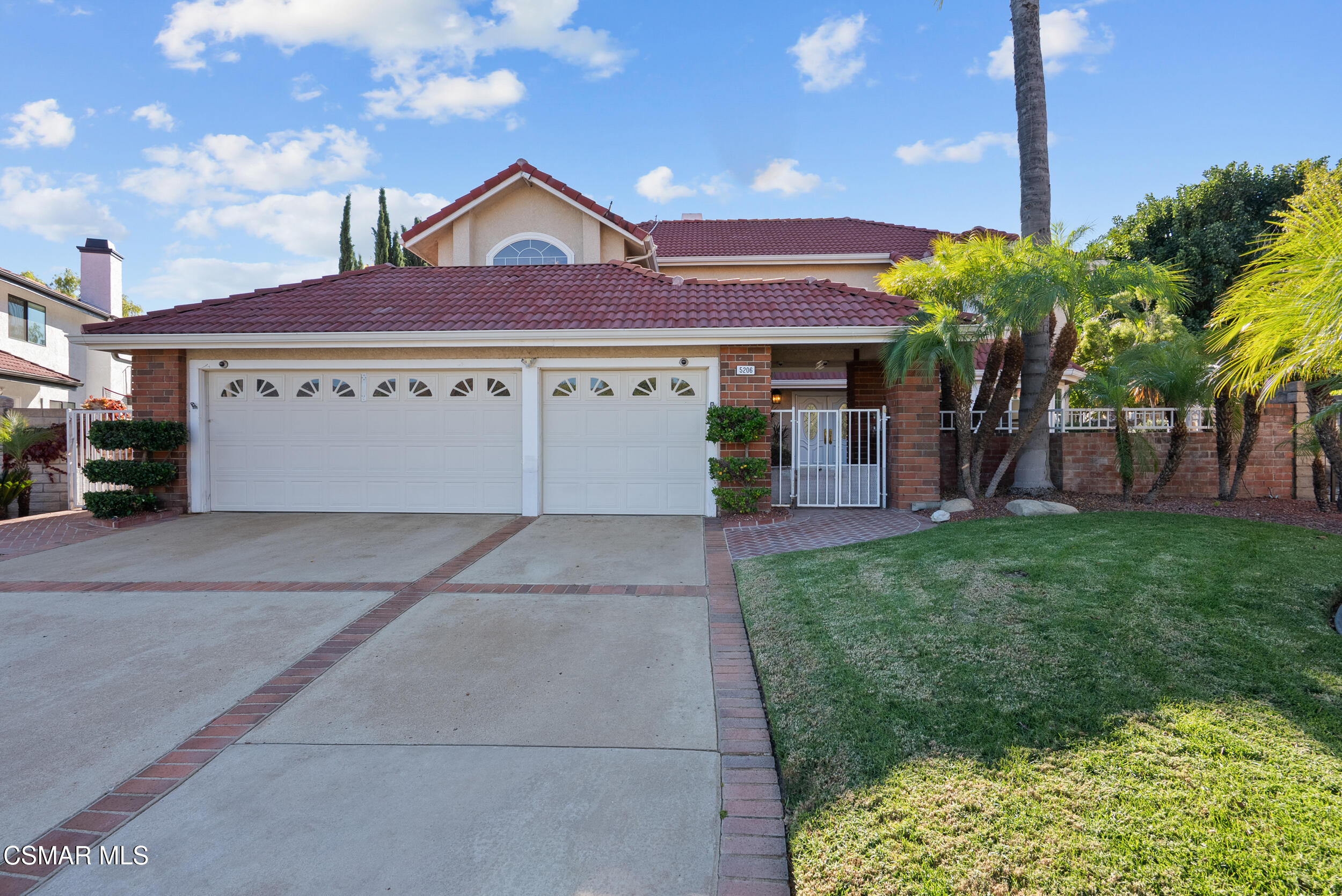 5206 Seneca Place Simi Valley, CA 93063 - Photo 21 of 92 a front view of a house with a yard and garage