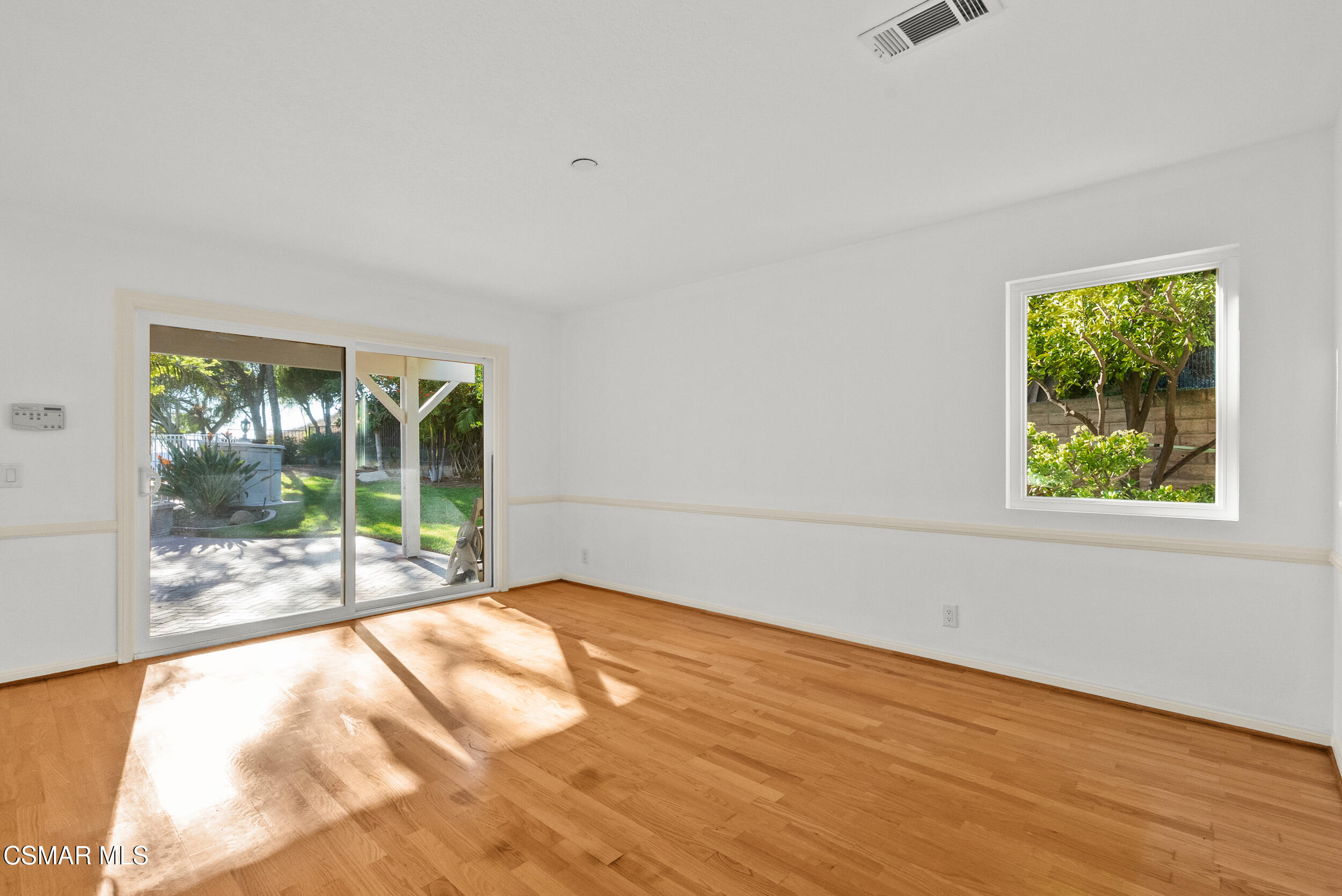 5206 Seneca Place Simi Valley, CA 93063 - Photo 31 of 92 a view of an empty room with wooden floor and a window