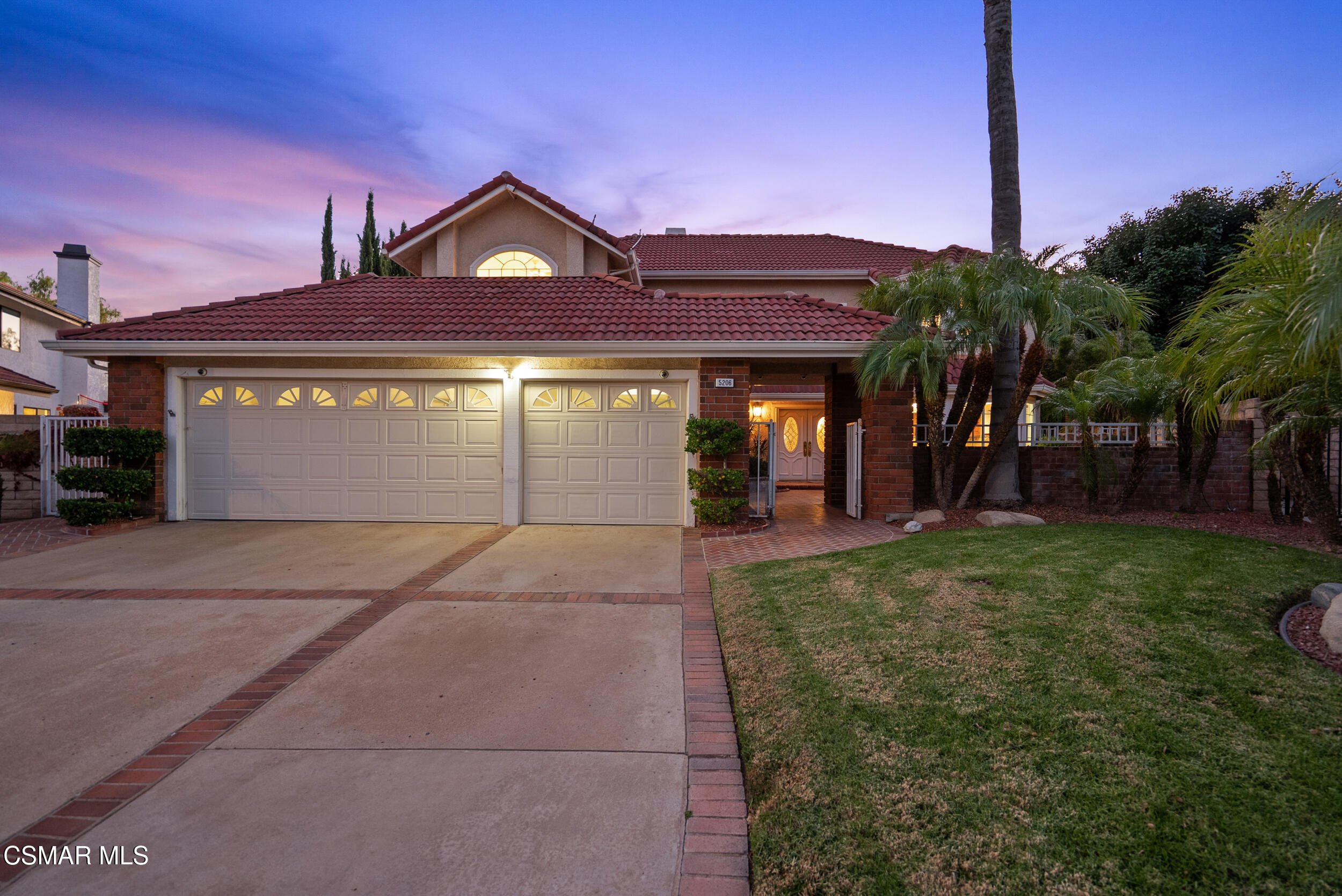 5206 Seneca Place Simi Valley, CA 93063 - Photo 6 of 92 a front view of a house with a yard and garage