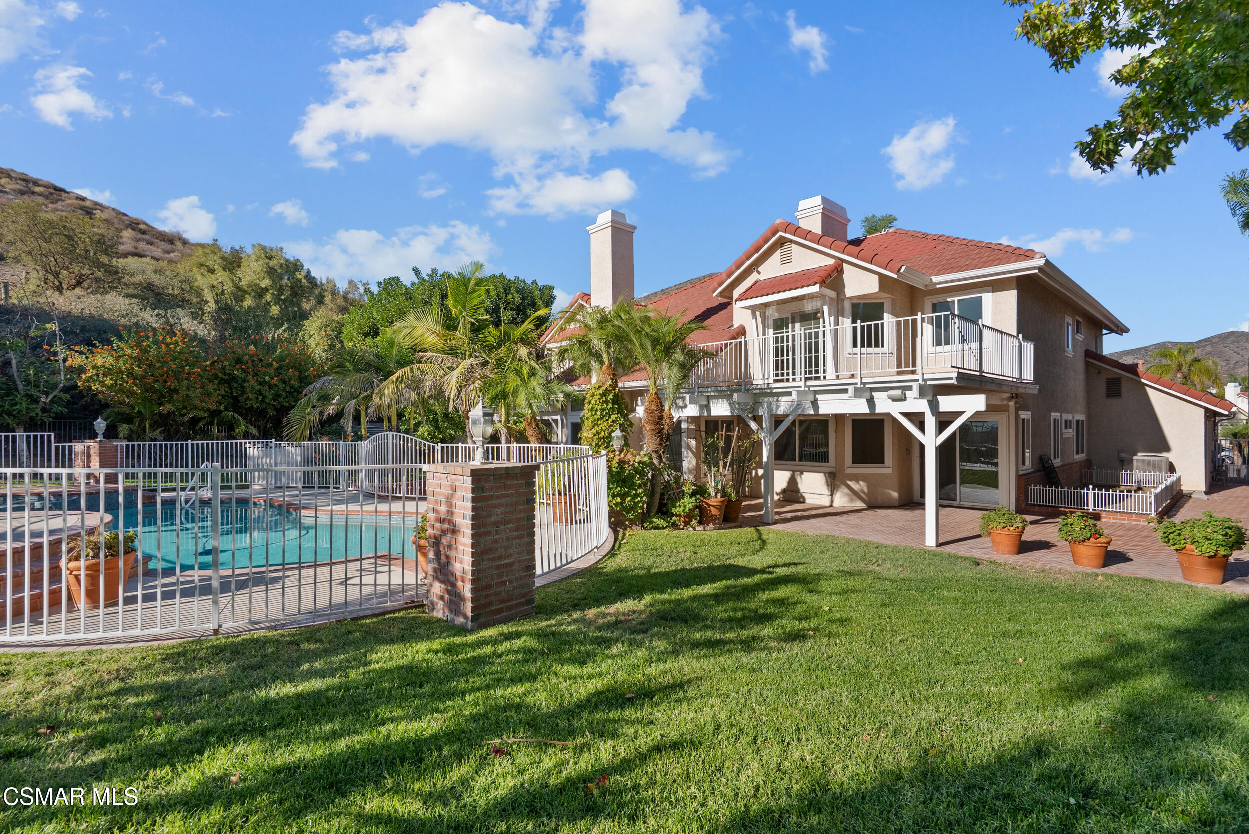 5206 Seneca Place Simi Valley, CA 93063 - Photo 84 of 92 a front view of a house with a yard table and chairs