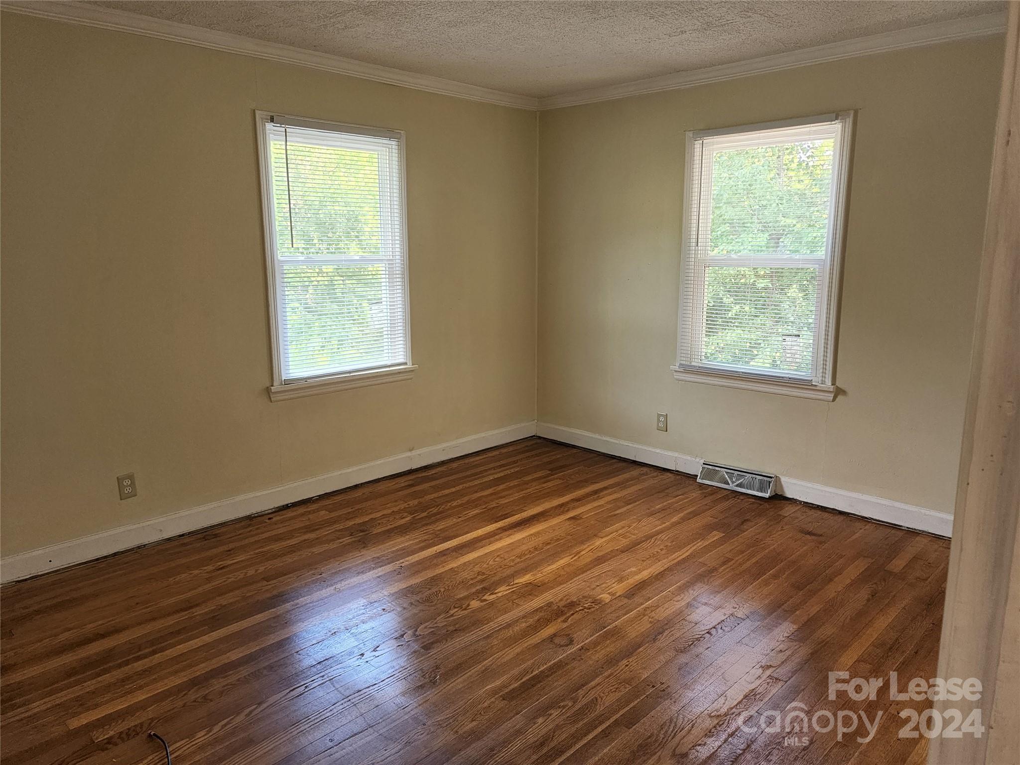 321 Pine Tree Es Drive Salisbury, NC 28144 - Photo 8 of 12 a view of an empty room with wooden floor and a window
