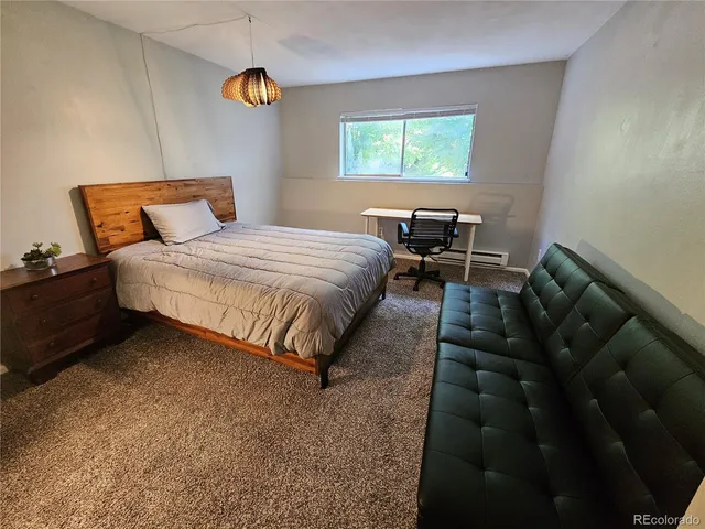 a bedroom with bed and window