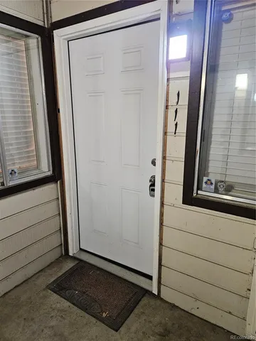 a view of front door and mirror