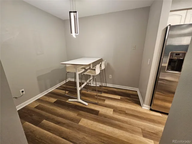 a room with gym equipment and a view of living room