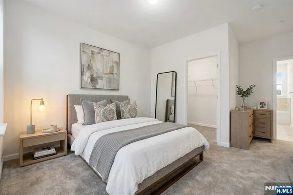 a bedroom with a bed and a couch